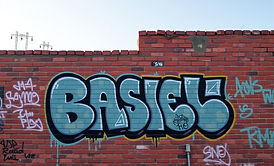 graffiti on a brick wall in a day light .jpg