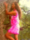 Folk Fusion Artist Shashi Light in pink tie-dye dress embraces tree