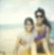 Shashi and daughter smiling on a boat