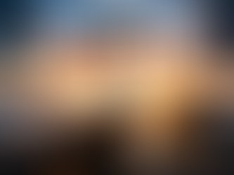 A person stands on a mountaintop breaking free from chains, overlooking a landscape of city streets and country roads below, with the words “Don’t Wait” displayed.