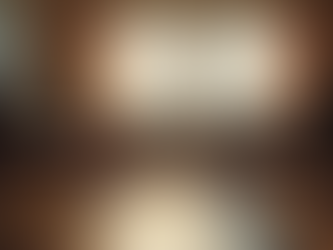 A circle of empty chairs arranged in a sunlit room, with warm light streaming through tall windows, symbolizing openness, safety, and the welcoming space of a peer support group.