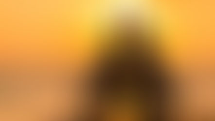 Couple sharing their first kiss on a beach boardwalk at sunset with the sun glowing behind them for My Poetry Corner.