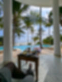 Guest enjoying breakfast on the terrace of the lounge at Villa Kidosho, Boutique Hotel Matlai, overlooking the Indian Ocean in a fully private villa setting in Zanzibar.