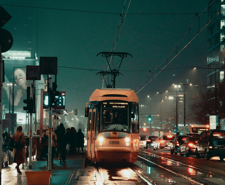 a city street filled with lots of traffic at night