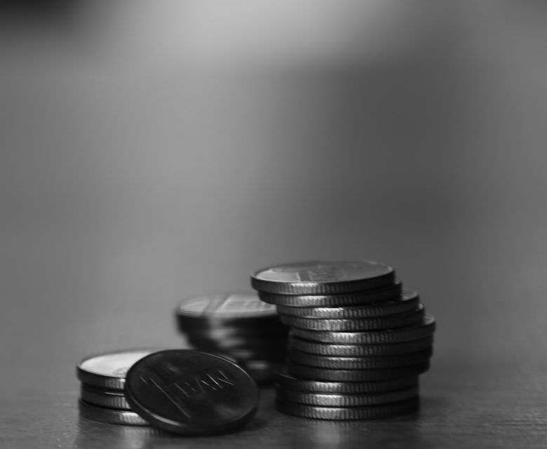 a stack of coins sitting on top of a table