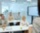People listen attentively during a business presentation.