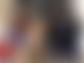 A dog that was panting and pacing sits at the vet hospital with its owner and the vet