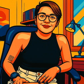 Portrait of a person in glasses and a black top smiling in a colorful room. A desk lamp, books, and a plant enhance the vibrant setting.