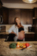 Pregnant registered dietitian in kitchen