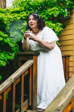 Queenee Mel Gonzalez taking dab in white dress