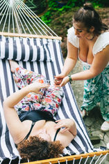 Rhiannon Binder lights Ishqa Hillman's joint