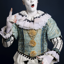 Clowning Through Collapse: Old God Confronts a World in Freefall
