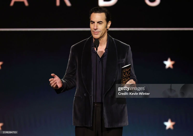 Sacha Baron Cohen Stuns in Thom Sweeney at the 30th Annual Critics’ Choice Awards
