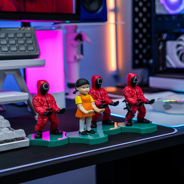 These Squid Game Phone Stands Might Be the Coolest Merch You’ll See This Week