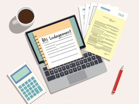 Open laptop on a desk with Australian tax papers and a BAS lodgement form beside it, representing bookkeeping and tax compliance tasks for businesses.