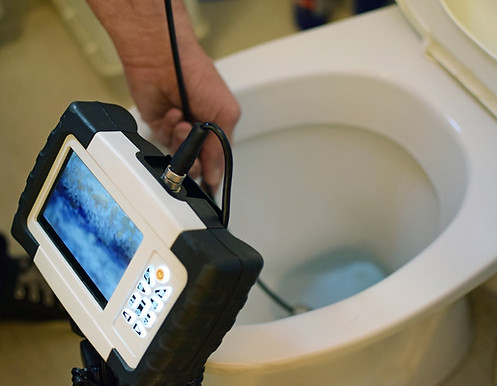 Image of toilet and sewer camera.