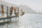 Thumbnail: Children playing on a wooden dock by Lake Wanaka with mountains in the background. One child is mid-air, flipping into water