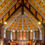 Thumbnail: The image captures the serene interior of a traditional wooden church in Whanganui, adorned with ornate carvings.
