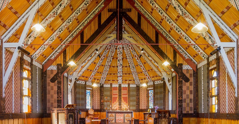 Thumbnail: The image captures the serene interior of a traditional wooden church in Whanganui, adorned with ornate carvings.