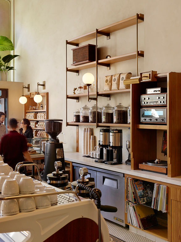 Sightglass on 20th cafe layout nestles all programmatic elements efficiently with full production roastery, vintage Probat roaster and inventively designed espresso and pour-over coffee bars.