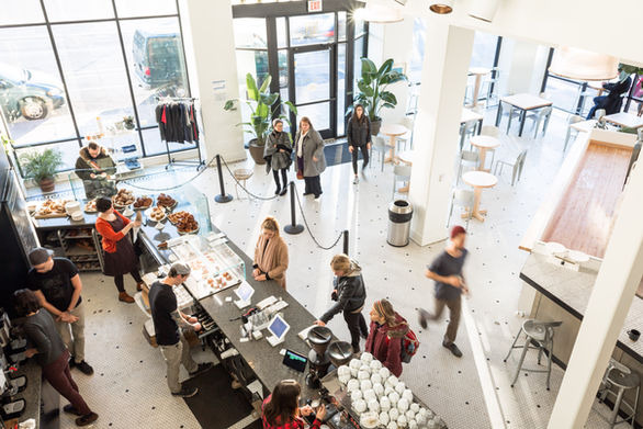 Messenger Coffee Co. coffee bar and cafe area with black and white colored detailing.