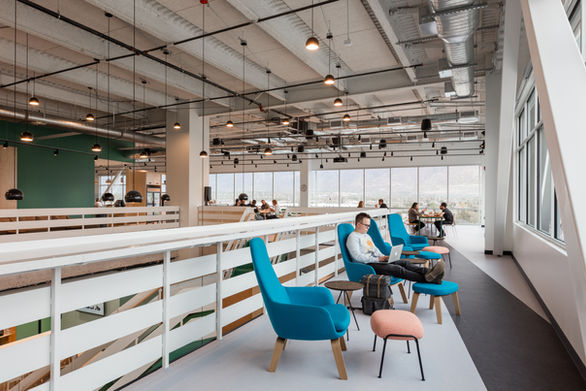 Thumbtack Utah open office areas gives a logic between social and introverted functions and sightlines to the beautiful setting with energetic color scheme and residential-inspired furnishing interiors.