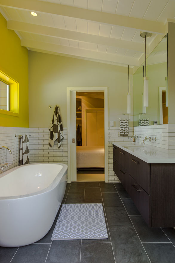 Cazadero House bathroom with skylight, soaking tub and neutral tones.