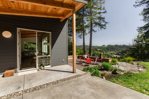 Cazadero House outdoor living space with views and connection to interior with to make the small house feel and live larger.