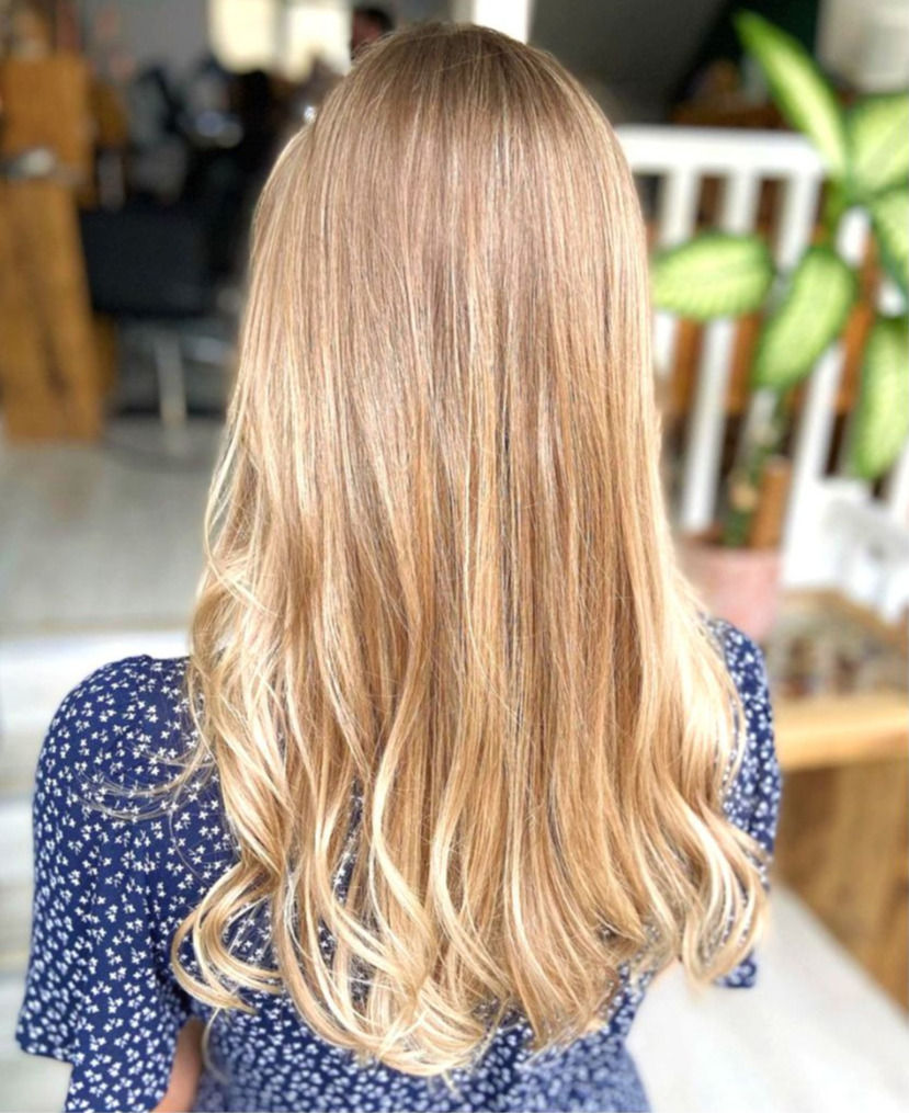 Subtle natural blonde balayage on long hair