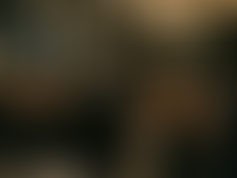 Band performing on stage with a singer and musicians in a classy venue, chandeliers overhead. Crowd watching, creating an energetic vibe.