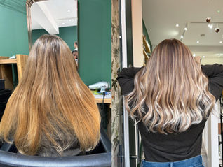 Before and after hair transformation: straight brown hair becomes wavy with blonde highlights. Salon setting, green walls, modern decor.