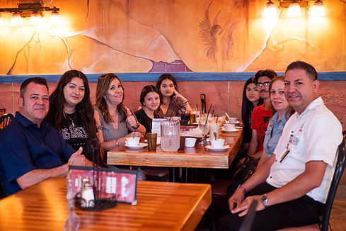 Jaime & waiter w customers.JPG
