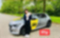A woman holding a certificate, celebrates passing her AA driving test