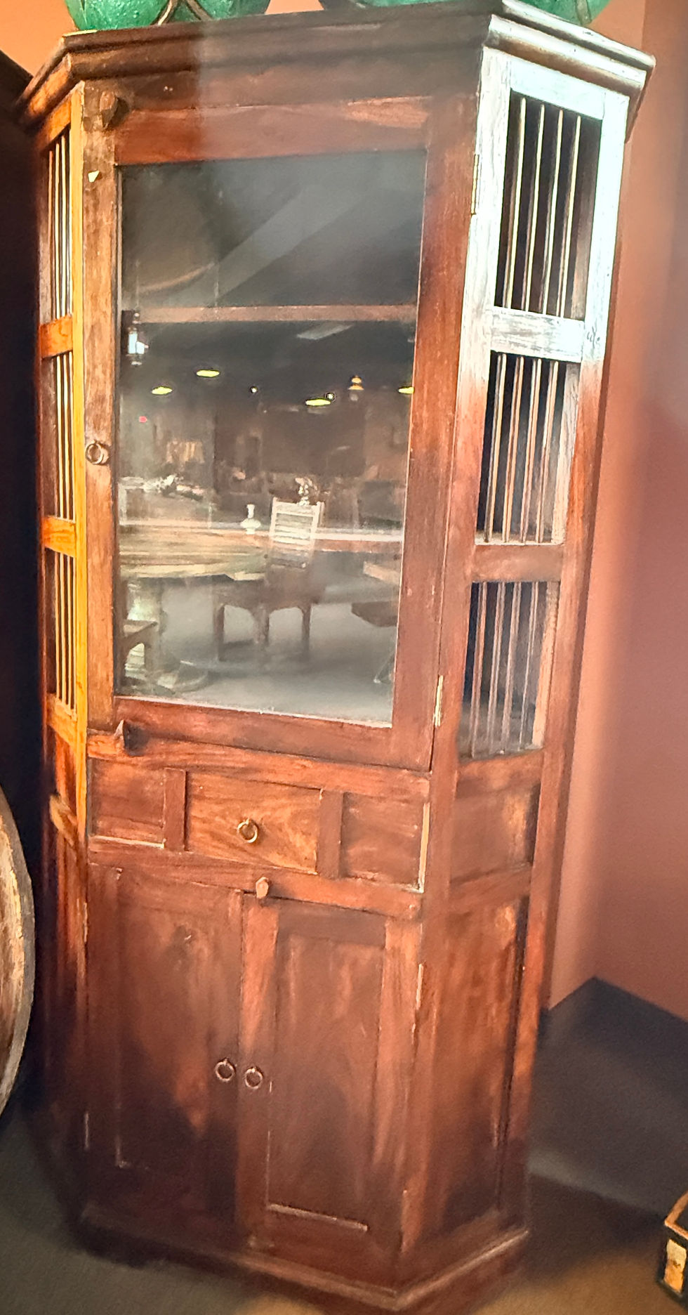 Thumbnail: Antique wooden display cabinet with glass door, storage drawers, and vertical slatted side panels.