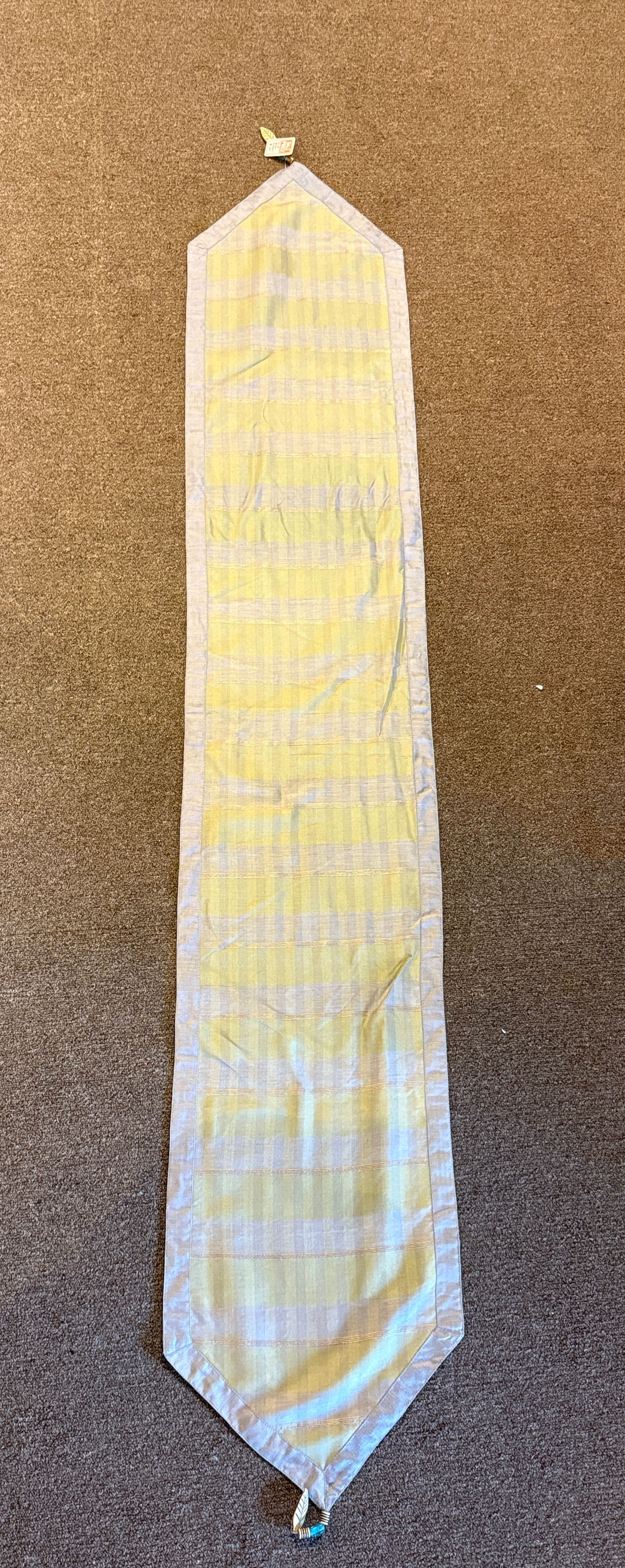 Champagne table runner with beaded vine embroidery and tassels