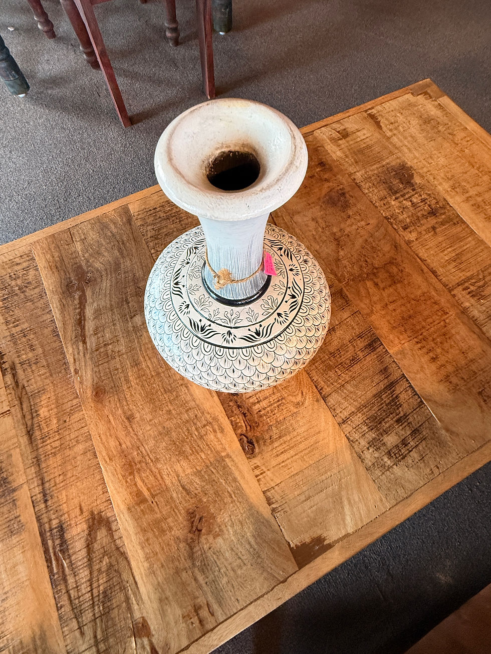 Thumbnail: Handcrafted ceramic vase with black and white designs, placed elegantly on a wooden table.