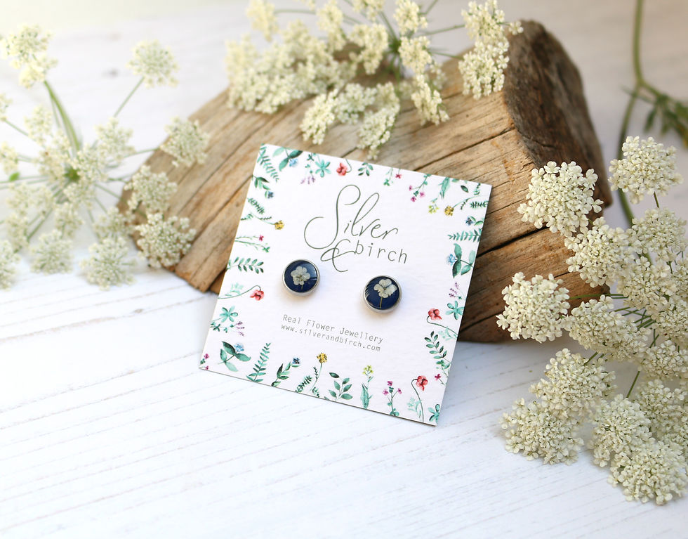Surgical stainless steel stud earrings in Navy blue, with real flower