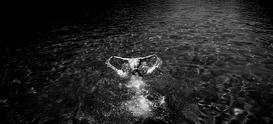 Cinematic photography capturing a couple’s love and intimate moments on a boat, creating timeless and romantic storytelling