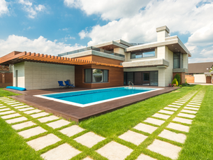 Custom gunite pool cost Las Vegas backyard with spa and travertine decking