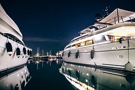 Luxury Yachts In La Spezia Harbor At Night With Reflection In Water. Italy.jpg