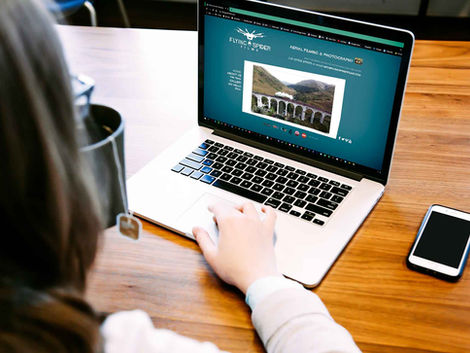 Person viewing website design on laptop