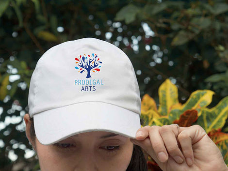 White baseball cap with Prodigal Arts logo