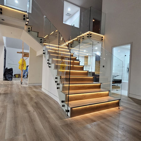 Warm oak, clean glass, and light that shifts from day to night. A functional element designed to be the heart of the home.