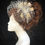 Thumbnail: silver and gold veiled fascinator