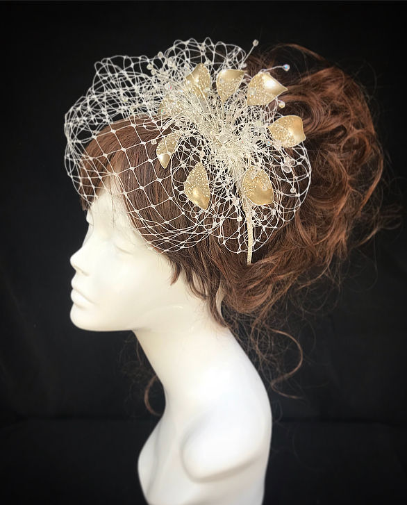Thumbnail: silver and gold veiled fascinator