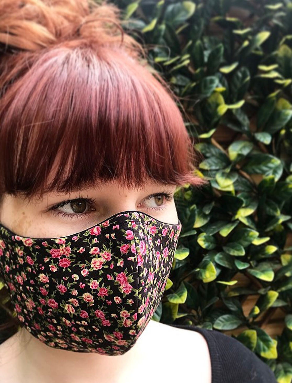 Black ditsy flower face mask
