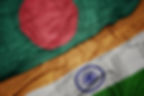waving colorful flag of india and national flag of bangladesh on the dollar money backgrou