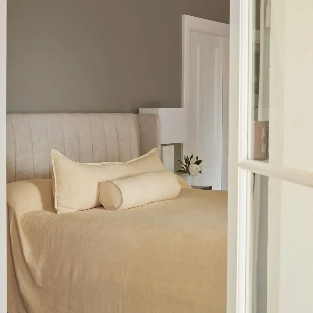 Luca Linen Bed Cover by Eadie Lifestyle in soft butter European linen styled on a modern bedroom.