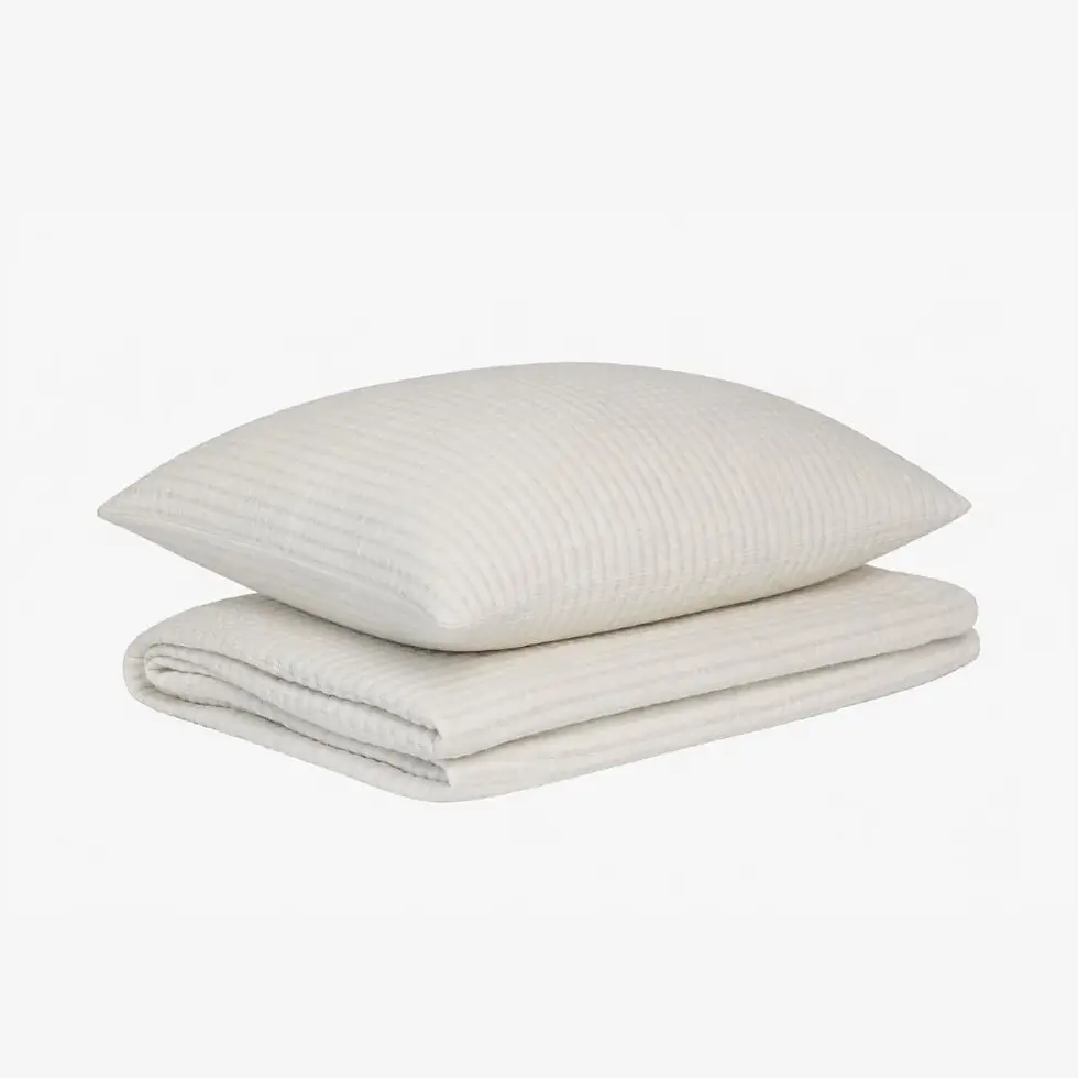 White cotton quilt set styled in a modern Australian bedroom with matching pillowcases