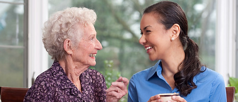 caregiver and elderly woman having tea_edited.jpg